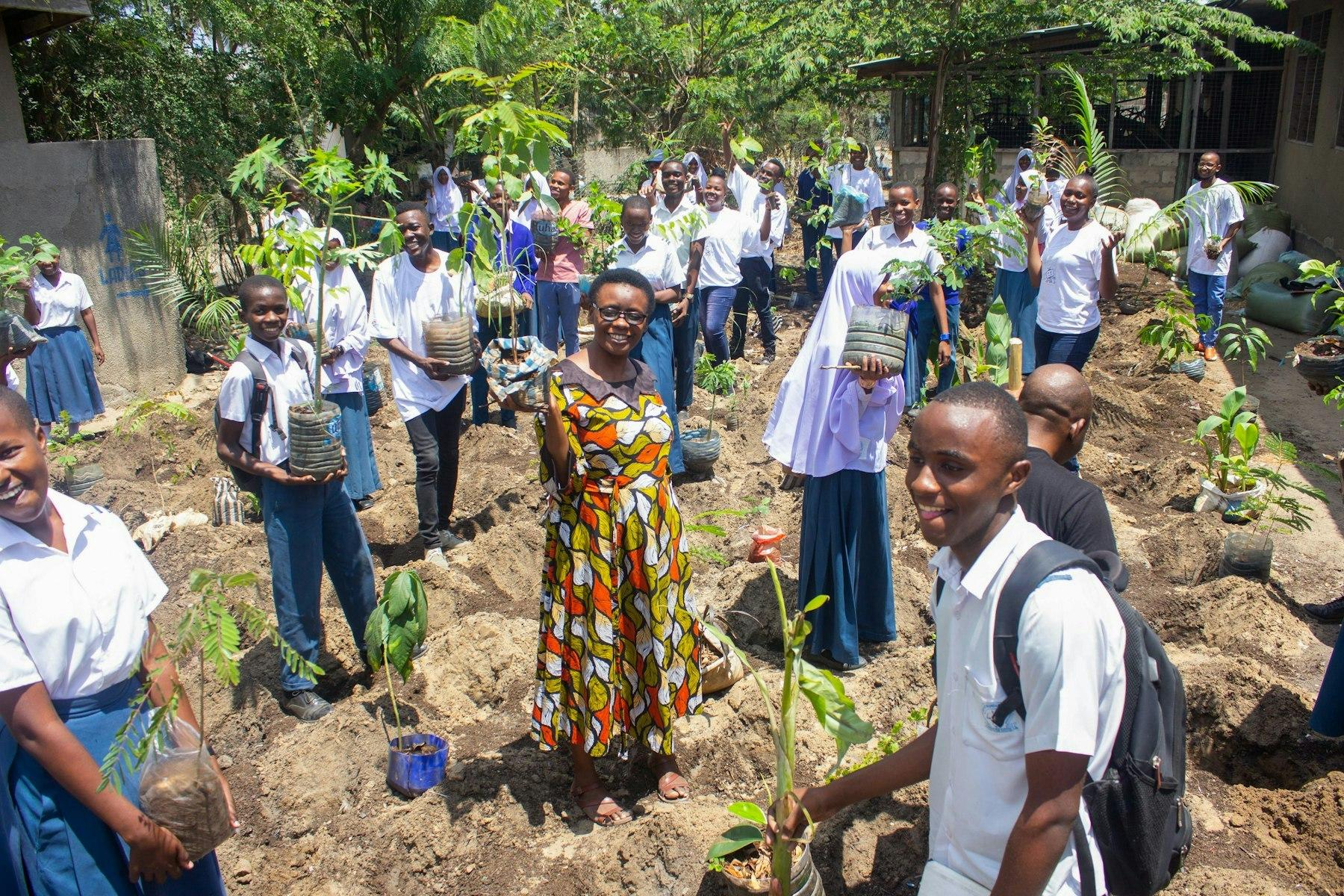 1682074485-students-teachers-and-volunteer-parents-engage-in-planting-micro-forests-at-mbande-secondary-schools-at-temeke-mc-dar-es-salaam-3.jpg