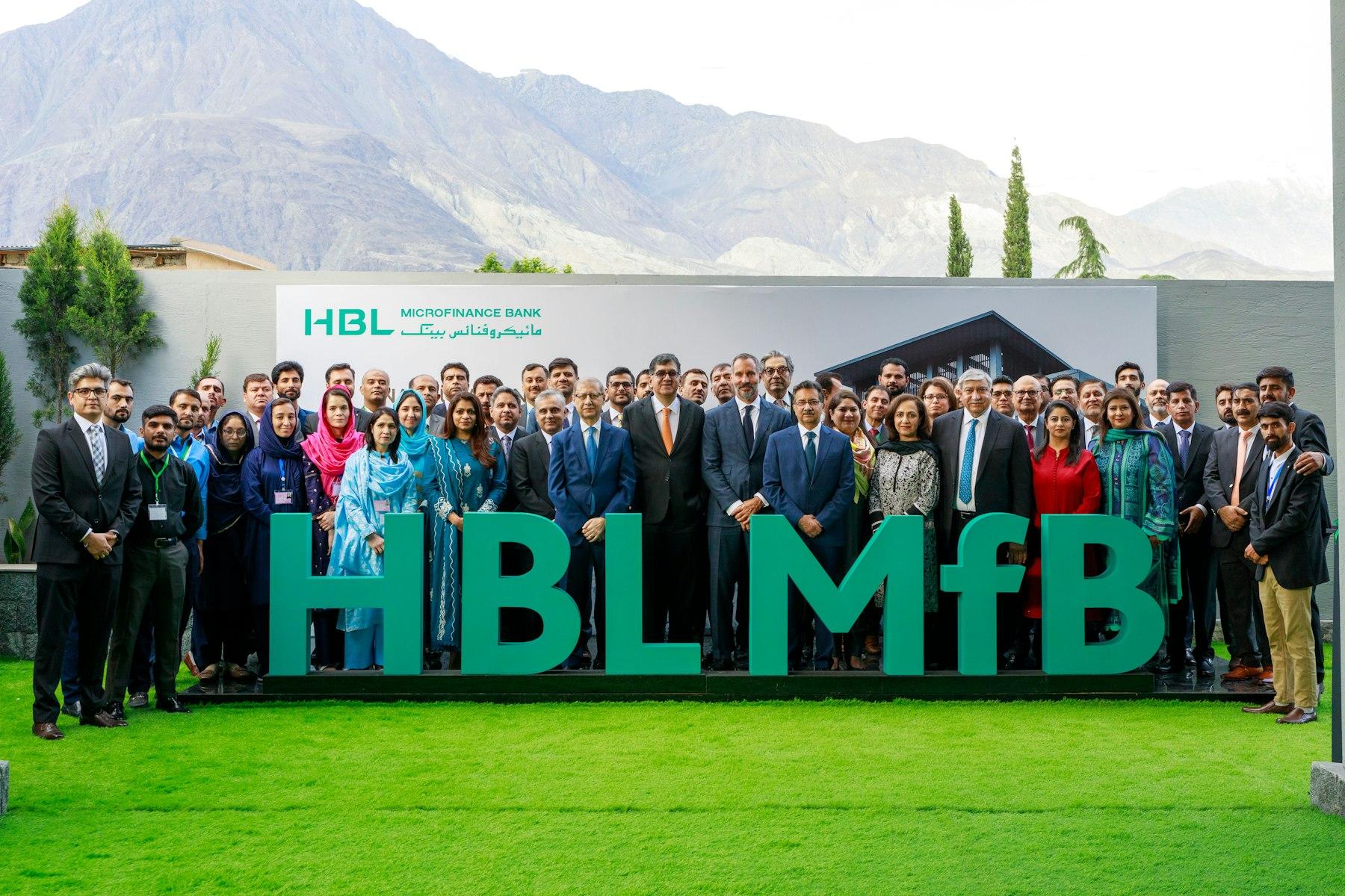 Prince Rahim Aga Khan poses for a photograph with the staff and leadership of HBL Microfinance Bank at the inauguration of its new Regional Headquarters for Gilgit-Baltistan.